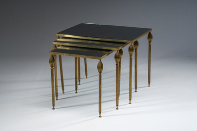 Three French Maison Jansen style brass nesting tables with fluted legs and mirrored glass tops, 1960s