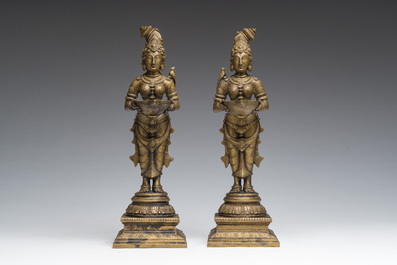 A pair of Indian oil lamps in the shape of Deepalakshmi with a bowl in her hands, 20th C.