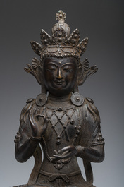 A Sino-Tibetan patinated bronze figure of Buddha, 20th C.