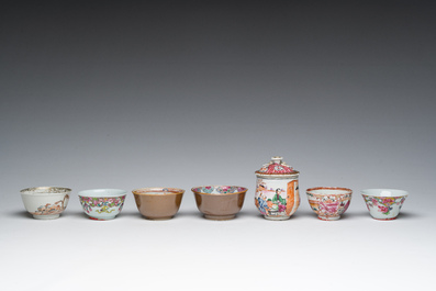 Six Chinese famille rose and gilt cups and saucers and a cream jug with floral and mandarin design, Yongzheng/Qianlong