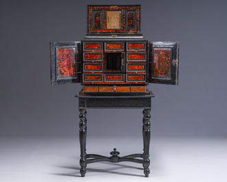 An ebonized wooden and tortoiseshell-veneered Antwerp cabinet on stand, 17th C. and later