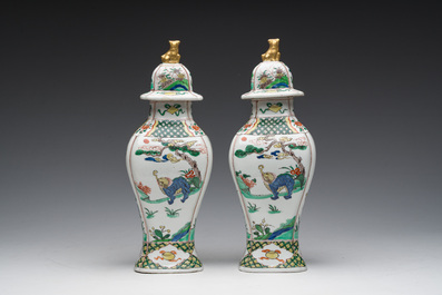 A pair of French Samson famille verte style 'mythical animals' vases and covers, Paris, 19th C.
