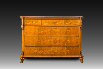 A North Italian commode with four drawers in mahogany and walnut with inlay of sphinxes and flowers in lemonwood, first third 19th C.