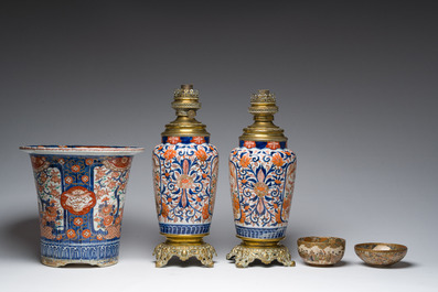 Two Japanese Satsuma bowls with animated scenes, an Imari jardini&egrave;re with floral design and two vases mounted into lamps, Meiji, 19th/20th C.