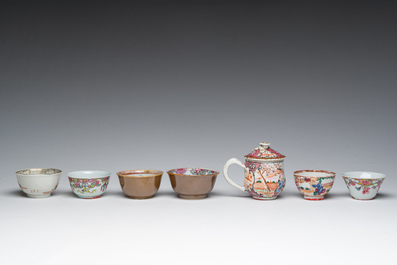 Six Chinese famille rose and gilt cups and saucers and a cream jug with floral and mandarin design, Yongzheng/Qianlong