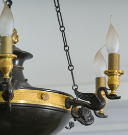 A French Empire style six-light patinated sheet metal and gilt bronze chandelier with swan design, 19th/20th C.