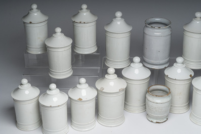 Two Dutch Delft blue and white and eighteen gilt and polychrome decorated porcelain pharmacy jars, 18th/19th C.