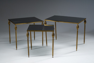 Three French Maison Jansen style brass nesting tables with fluted legs and mirrored glass tops, 1960s