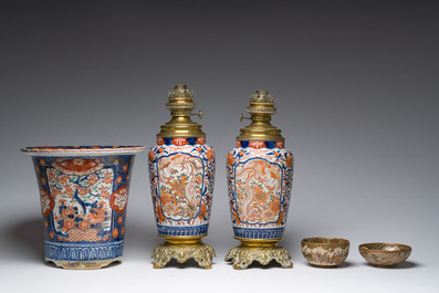 Two Japanese Satsuma bowls with animated scenes, an Imari jardini&egrave;re with floral design and two vases mounted into lamps, Meiji, 19th/20th C.