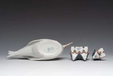 Three Danish Royal Copenhagen polychrome decorated porcelain models of an Arctic tern and penguins, 20th C.