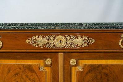 An imposing French Empire style gilt bronze mounted cherrywood dresser with a green marble top, 20th C.