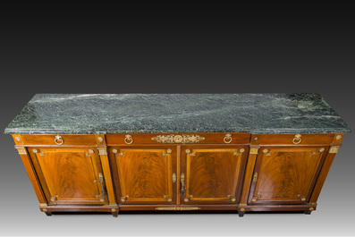 An imposing French Empire style gilt bronze mounted cherrywood dresser with a green marble top, 20th C.