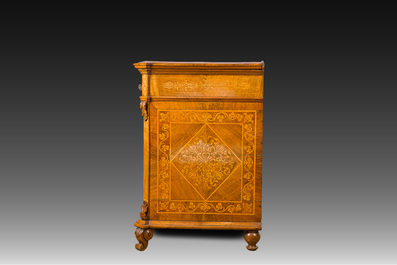 A North Italian commode with four drawers in mahogany and walnut with inlay of sphinxes and flowers in lemonwood, first third 19th C.
