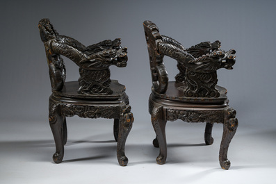 A pair of Japanese carved wooden 'dragon' chairs, Meiji, 19th/20th C.