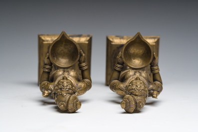 A pair of Indian oil lamps in the shape of Deepalakshmi with a bowl in her hands, 20th C.