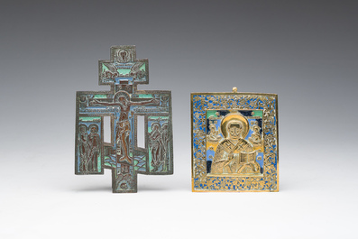 Two Russian orthodox partly enamelled bronze travel icons and an icon cross, 19th/20th C.