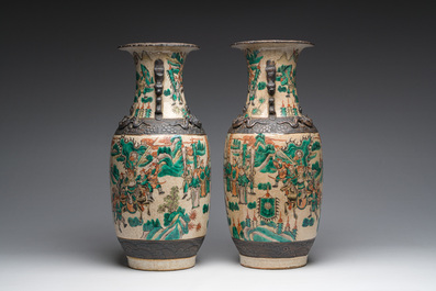 A pair of Chinese Nanking crackle glazed famille verte 'warrior' vases, 19th C.