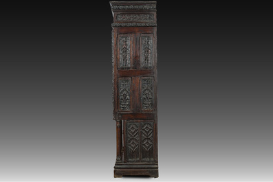 A French Gothic Revival carved wooden cabinet with two doors and two drawers with a fleur-de-lis design, 19th C.