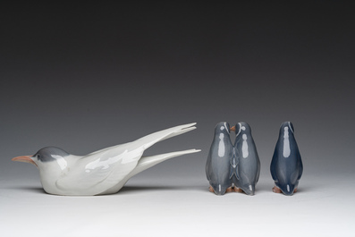 Three Danish Royal Copenhagen polychrome decorated porcelain models of an Arctic tern and penguins, 20th C.