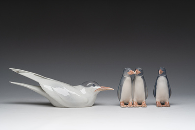 Three Danish Royal Copenhagen polychrome decorated porcelain models of an Arctic tern and penguins, 20th C.