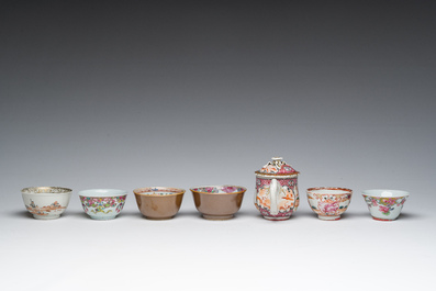 Six Chinese famille rose and gilt cups and saucers and a cream jug with floral and mandarin design, Yongzheng/Qianlong