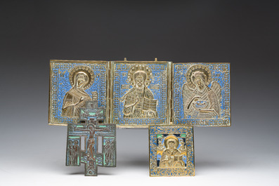 Two Russian orthodox partly enamelled bronze travel icons and an icon cross, 19th/20th C.