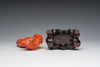 A Chinese red coral group with the 'Star God' Shou Xing and a lady, 19th/20th C.