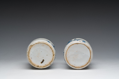 Three Dutch Delft blue and white dishes with a bird and floral design and two pharmacy jars, 18th C.