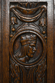 A French richly carved oak Neo-Renaissance credence with portrait miniatures, 19th C.