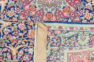 A Persian Sarouk rug with floral design, wool on cotton, 20th C.