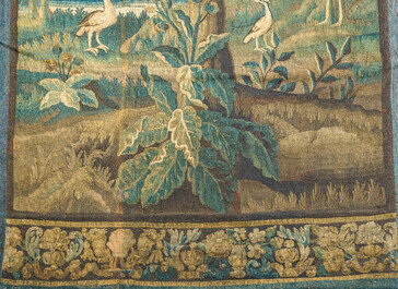 A Flemish wall tapestry with birds in a landscape with a castle in the background, 17th C.