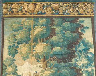 A Flemish wall tapestry with birds in a landscape with a castle in the background, 17th C.