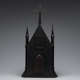 A large French Gothic Revival ebonized wooden cathedral-shaped reliquary with various relics, last quarter 19th C.