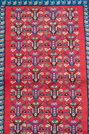 Four oriental rugs, a.o. a Persian Shirvan rug and an Azerbaijani runner with geometric design, wool on cotton, 20th C.
