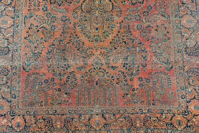 A Persian American Sarouk rug with floral design, wool on cotton, 20th C.