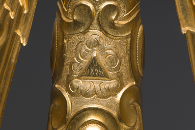 A large French gilt bronze monstrance decorated with cherubs amidst radiant clouds and set with glass stones, ca. 1900