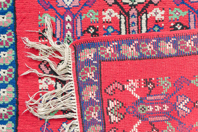 Four oriental rugs, a.o. a Persian Shirvan rug and an Azerbaijani runner with geometric design, wool on cotton, 20th C.