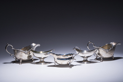 Three English silver sauce boats and a pair of 'armorial' salt cellars, 18th/20th C.