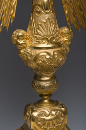A large French gilt bronze monstrance decorated with cherubs amidst radiant clouds and set with glass stones, ca. 1900