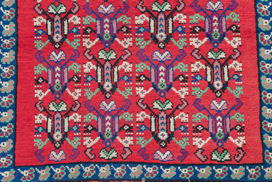 Four oriental rugs, a.o. a Persian Shirvan rug and an Azerbaijani runner with geometric design, wool on cotton, 20th C.
