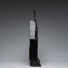 A large French Gothic Revival ebonized wooden cathedral-shaped reliquary with various relics, last quarter 19th C.