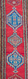 Four oriental rugs, a.o. a Persian Shirvan rug and an Azerbaijani runner with geometric design, wool on cotton, 20th C.