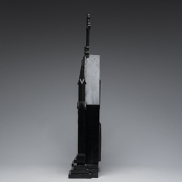 A large French Gothic Revival ebonized wooden cathedral-shaped reliquary with various relics, last quarter 19th C.