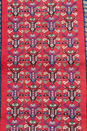 Four oriental rugs, a.o. a Persian Shirvan rug and an Azerbaijani runner with geometric design, wool on cotton, 20th C.