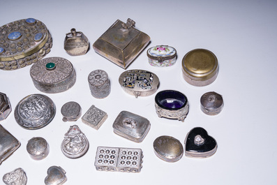 A varied collection of 33 pill boxes in silver and (silver-plated) metal finished with mother-of-pearl, turquoise, etc., various origins, 20th C.