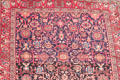 Four oriental rugs, a.o. Tabriz, Sarouk and Hamadan/Nahavand rugs with floral and geometric design, wool and cotton, 20th C.