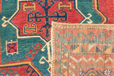 A Kazakh wool Fachralo rug with geometric and floral design, first half 20th C.