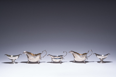 Three English silver sauce boats and a pair of 'armorial' salt cellars, 18th/20th C.
