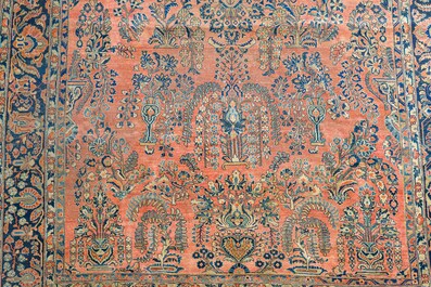 A Persian Sarouk rug with floral design, wool on cotton, first half 20th C.