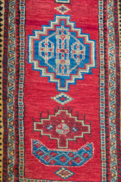 Four oriental rugs, a.o. a Persian Shirvan rug and an Azerbaijani runner with geometric design, wool on cotton, 20th C.